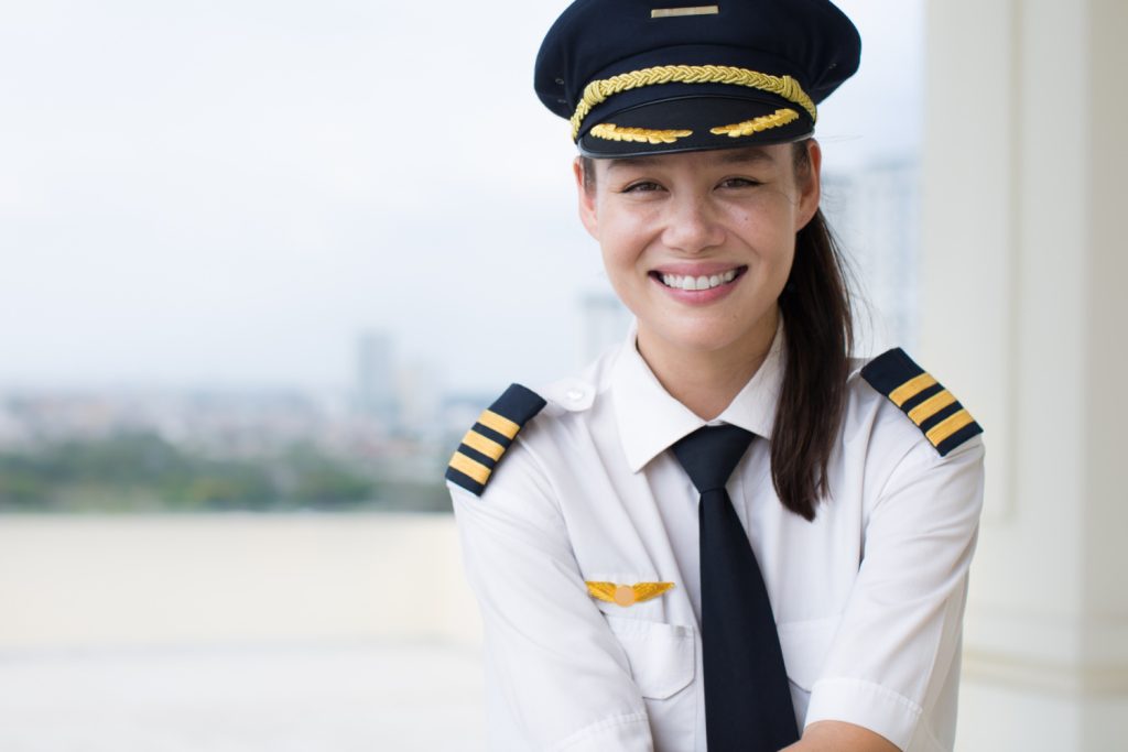 Smiling female pilot in uniform